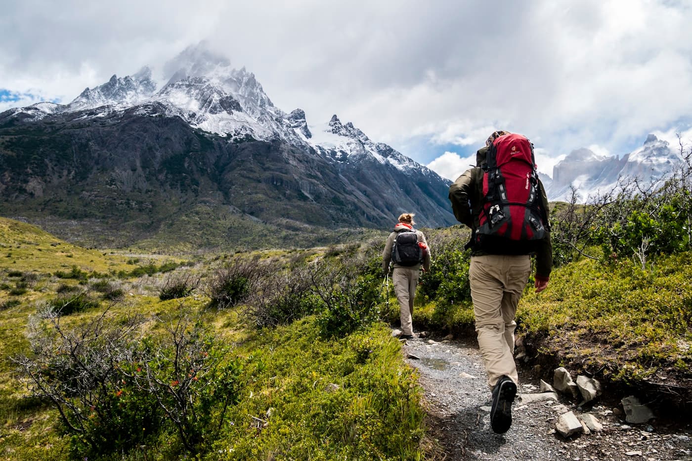 People hiking a mountain trail — illustrative of Bend trail culture.